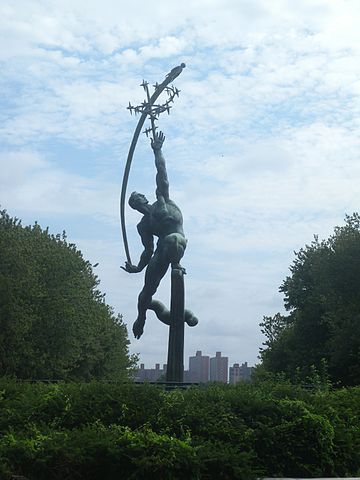 Statue of man throwing rocket to the stars